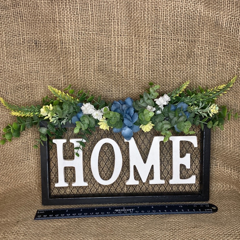 Upcycled, distressed “HOME” sign